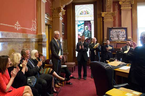 MSU Denver President Stephen M. Jordan (standing left) receives accolades in the Colorado State Senate chambers for his service to the University. Jordan was honored by the Legislature on April 19, 2017.