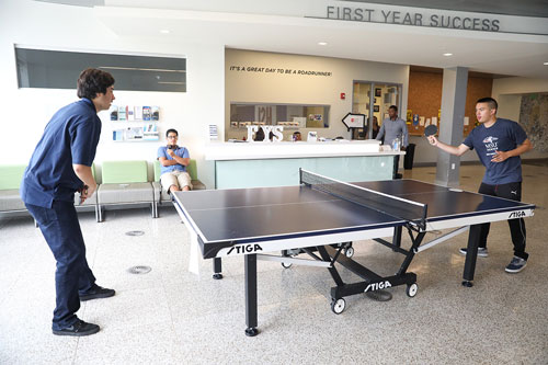 MSU Denver students Andrew Hale, left, and Casey Baker play a game of table tennis in front of the First Year Success office on the second floor of the Student Success Building. The office mentors first year students and helps to build a sense of community. Photo by Alyson McClaran