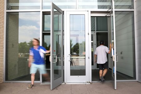 People entering and exiting the Student Success Building.