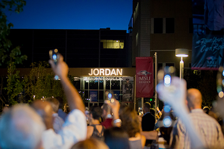 Attendees raise a glass to the newly-named Jordan Student Success Building, honoring 12 years of transformation at MSU Denver.