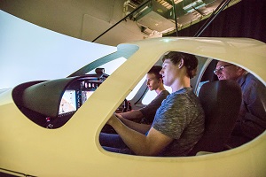 Student in training cockpit.