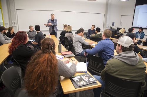 Students listening to professor