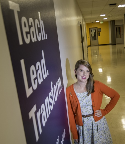 Margaret Thulson leaning against Education building wall