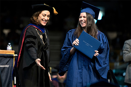 President Davidson with a student at graduation