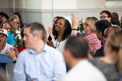 Employee being recognized at Roadrunners Who Soar event