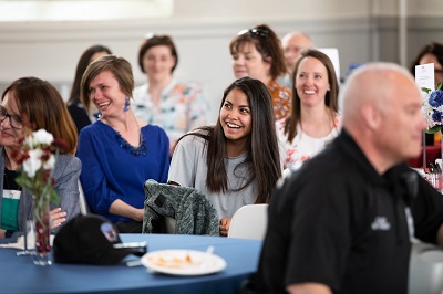 Employee being recognized at Roadrunners Who Soar event