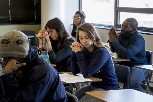 Students in desks in a classroom