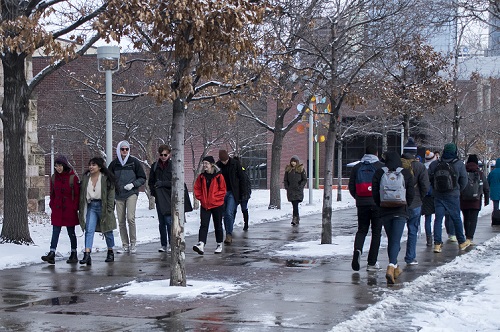 Students walking on campus on snowy day