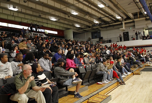 Roadrunner fans sitting in PE Building bleachers