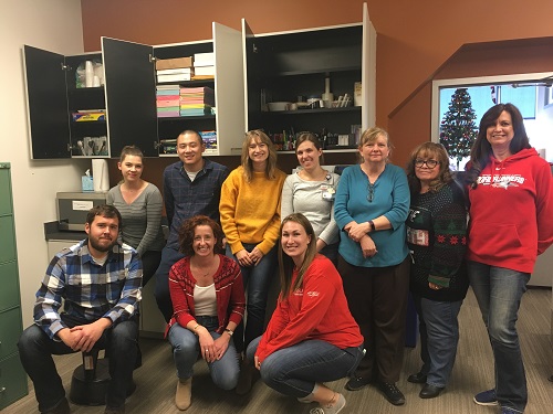 Sarah Buller and colleagues in copy room