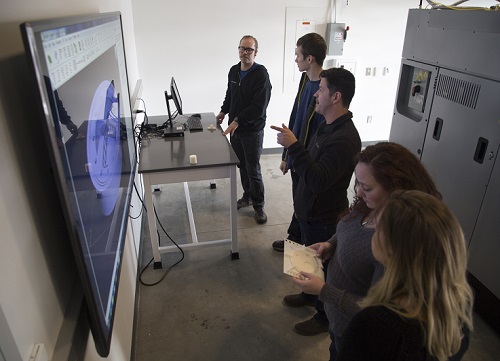 Students in AES lab looking at monitor