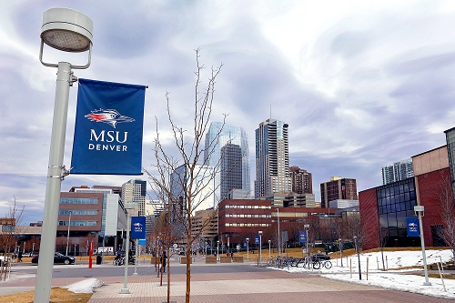 MSU Denver sign with Denver skyline in background