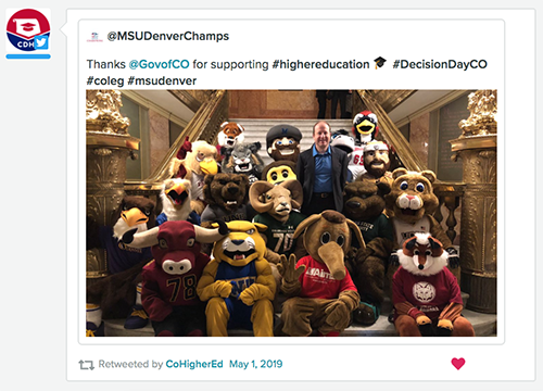 All Colorado university mascots sitting on Capitol steps with Gov. Jared Polis.