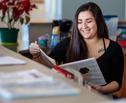 Crystalann Archuleta working at a desk.