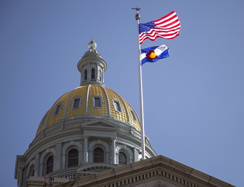 Capitol building with flags.