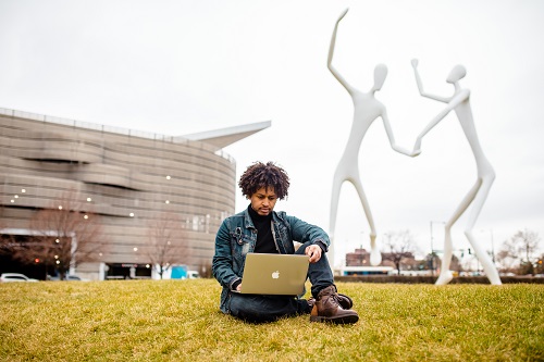 Student Agazi Abay studying near Denver Performing Arts Complex.