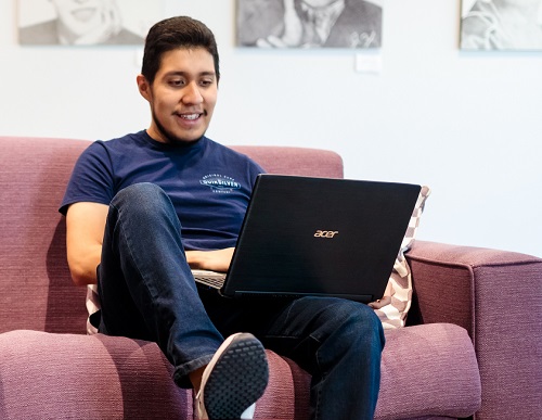 Student working on laptop.