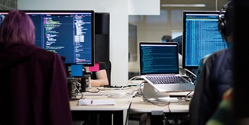 Students working on desktop computers