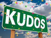 An illustration that shows a sign that says Kudos.