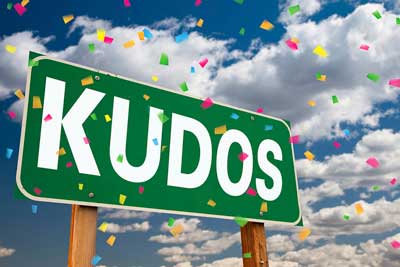 A sign that says kudos